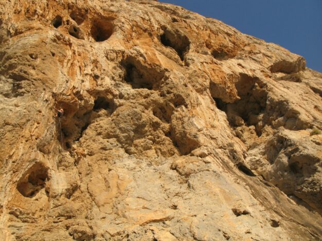 Simon Montmory equiping new routes at the sector Inspiration in Telendos